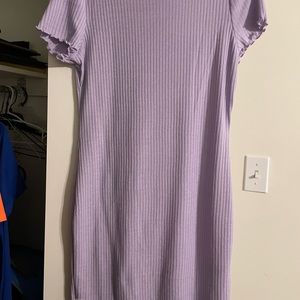 Ribbed dress with lettuce style neck and sleeves.